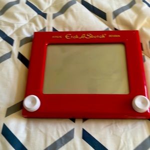 A fun toy for kids and to erase the sketch u shake the toy